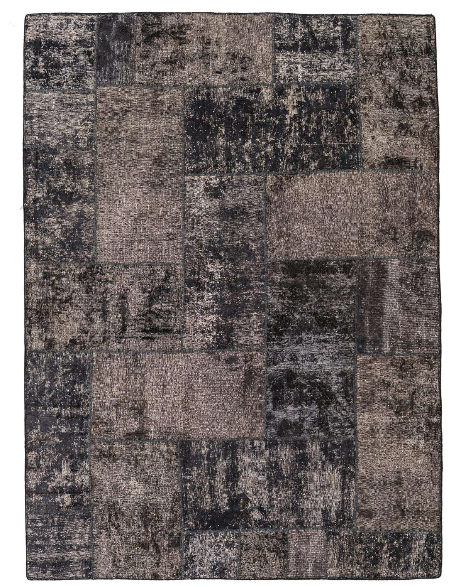 A 5x8 rectangular Ultra Vintage wool rug featuring a distressed patchwork design in varying shades of gray and silver.