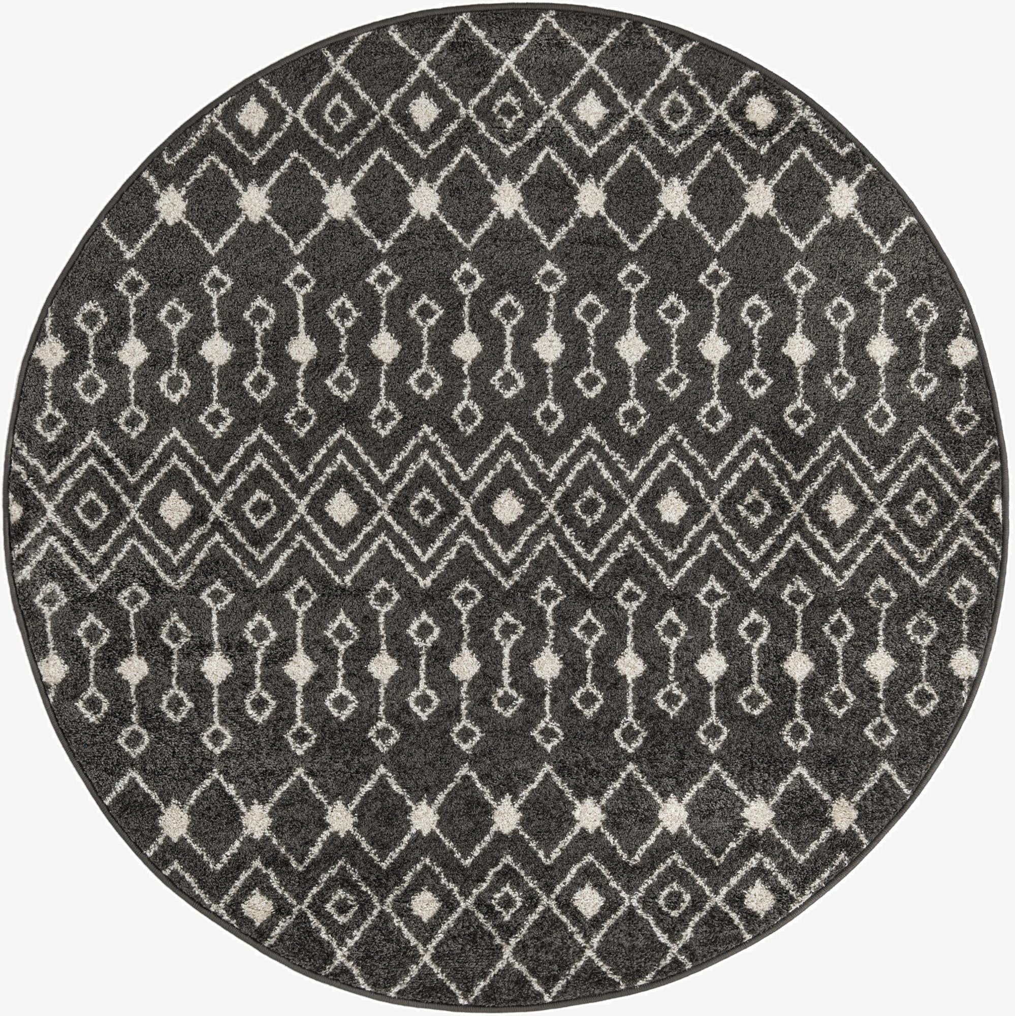 A 5' 3 round gray area rug with a bohemian trellis pattern in off-white, suitable for indoor spaces.