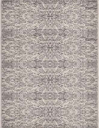 A 13 ft runner rug in shades of gray and silver, featuring an intricate medallion and bohemian pattern, ideal for a hallway.