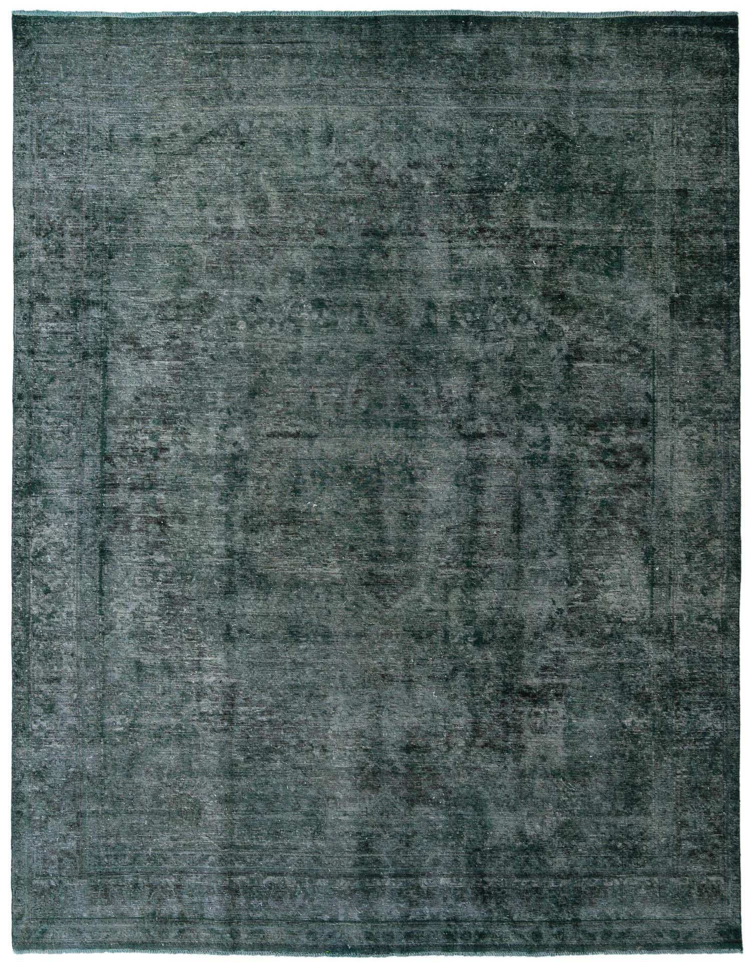 A 10x13 rectangular green Persian-style rug with a distressed vintage medallion pattern, suitable for a living room.