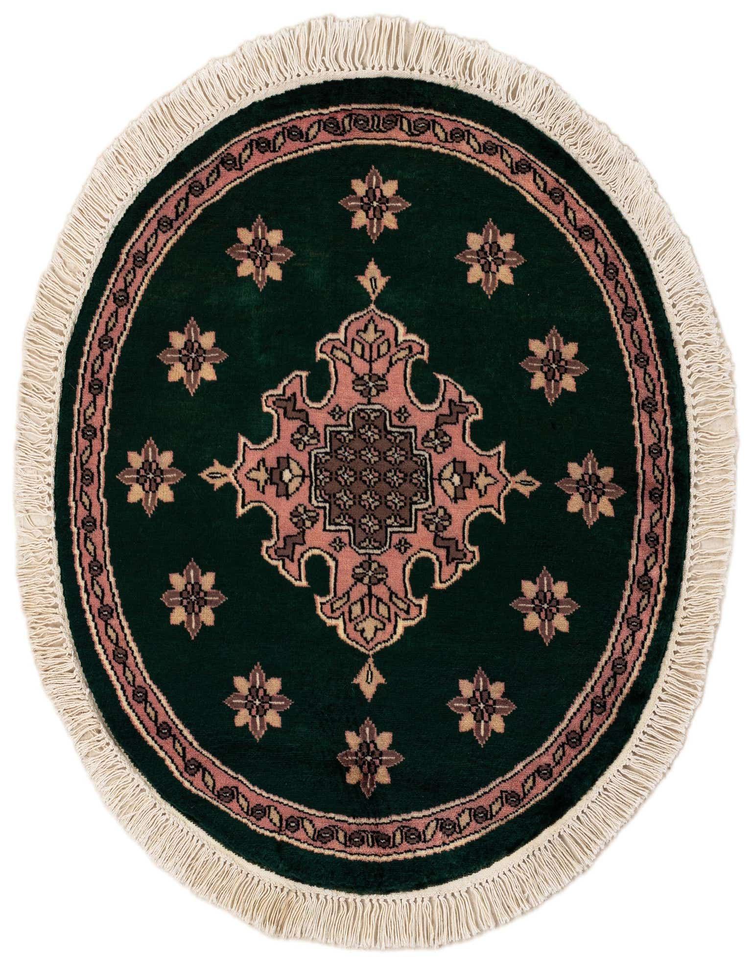 A round 2' 7" green Bokhara wool rug with a central pink and brown medallion, surrounded by floral motifs and a detailed border, finished with white fringe.