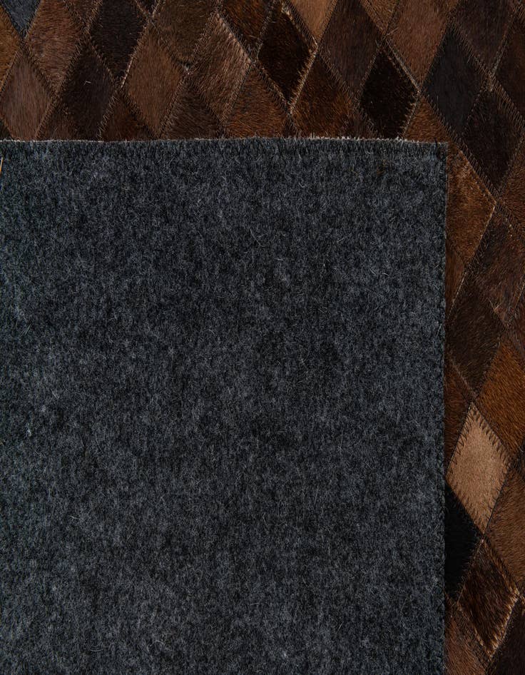 Detail image of  5' 1 x 8' Cowhide Stocks Rug