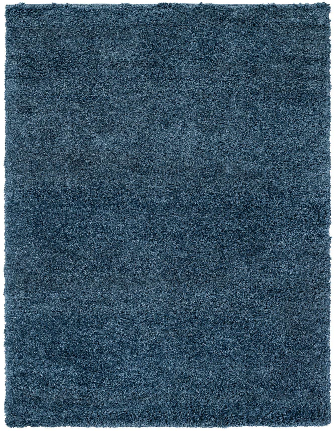 A rectangular 6x9 deep blue shag area rug with a textured pile, perfect for a cozy living room.