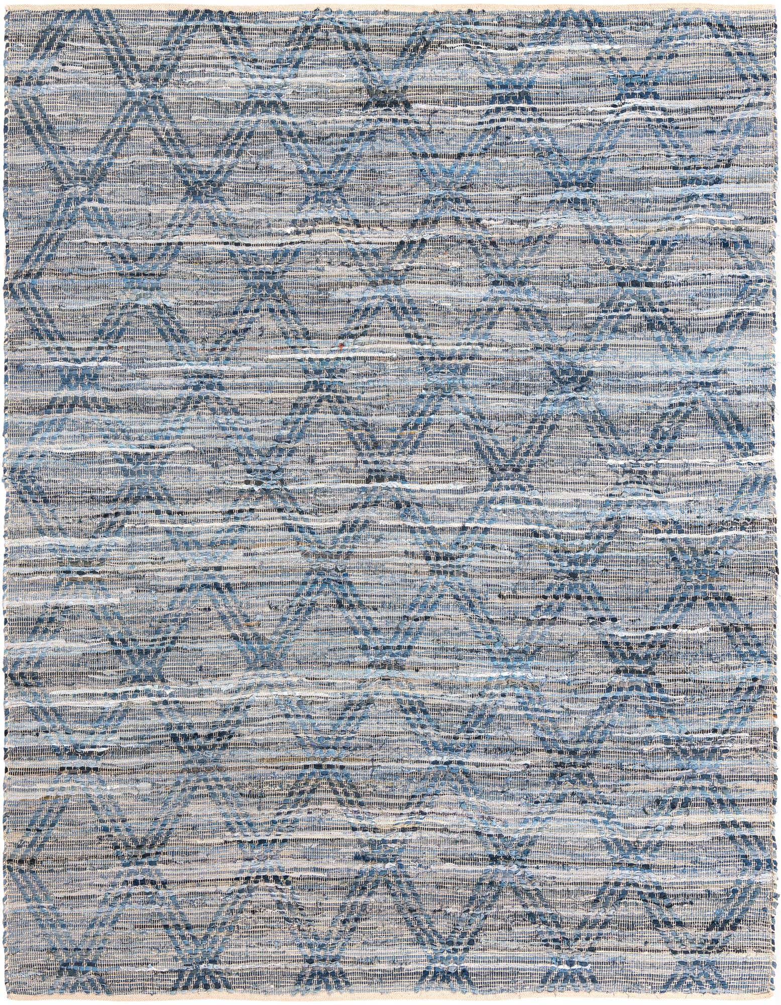A rectangular 8x10 denim blue Chindi cotton rug with a subtle geometric pattern, suitable for a living room.