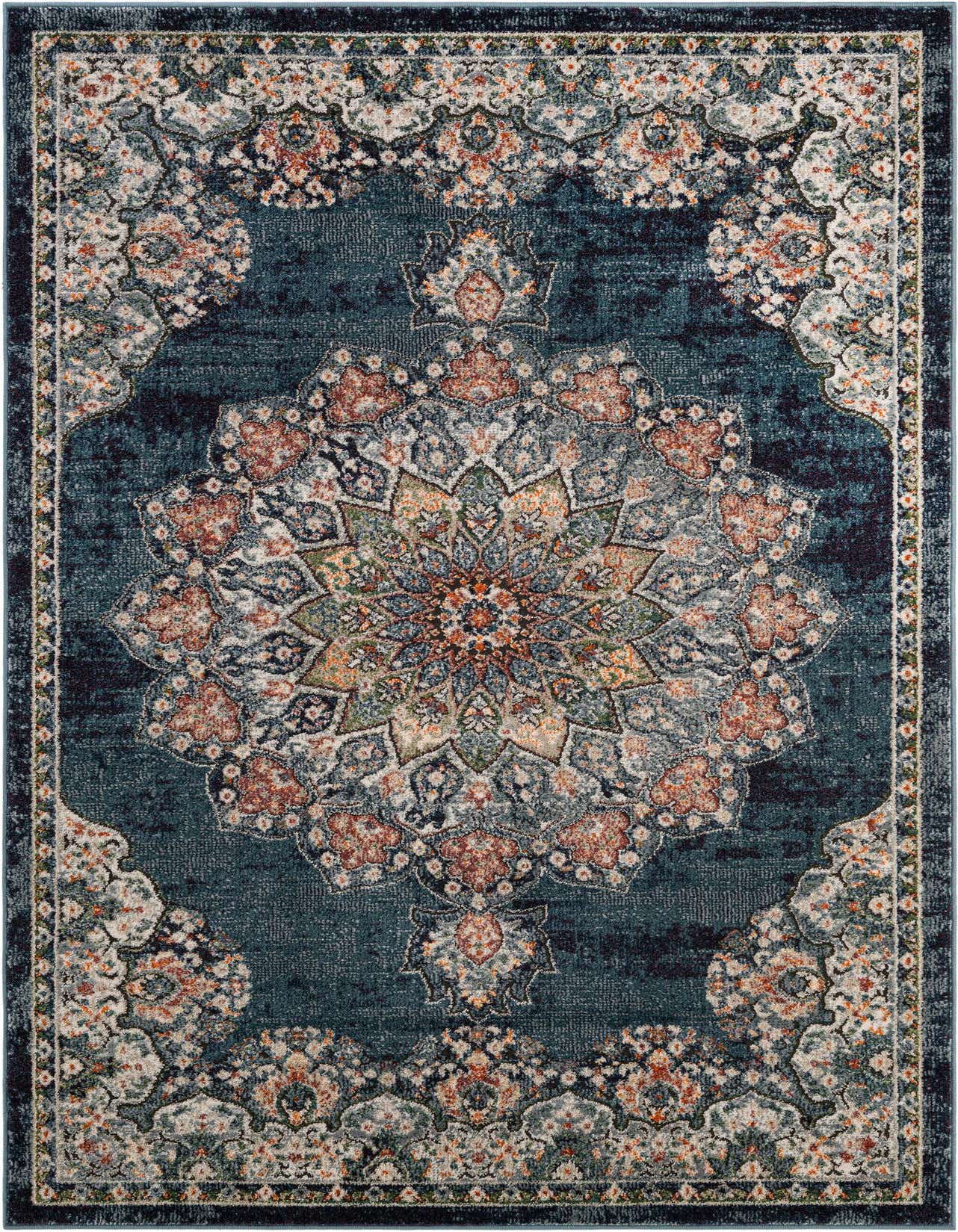 A 5x8 rectangular denim blue area rug with an ornate, distressed medallion pattern in rust, cream, and green.