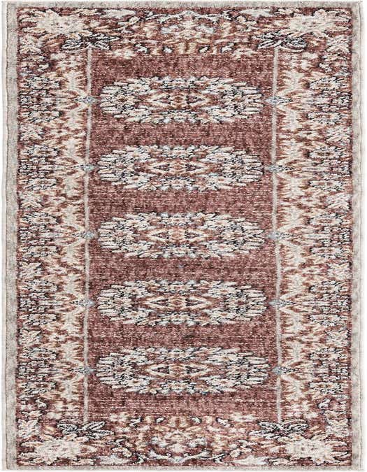 An 8 ft runner rug in a traditional medallion pattern with shades of pink, cream, and hints of blue, ideal for a hallway or kitchen.