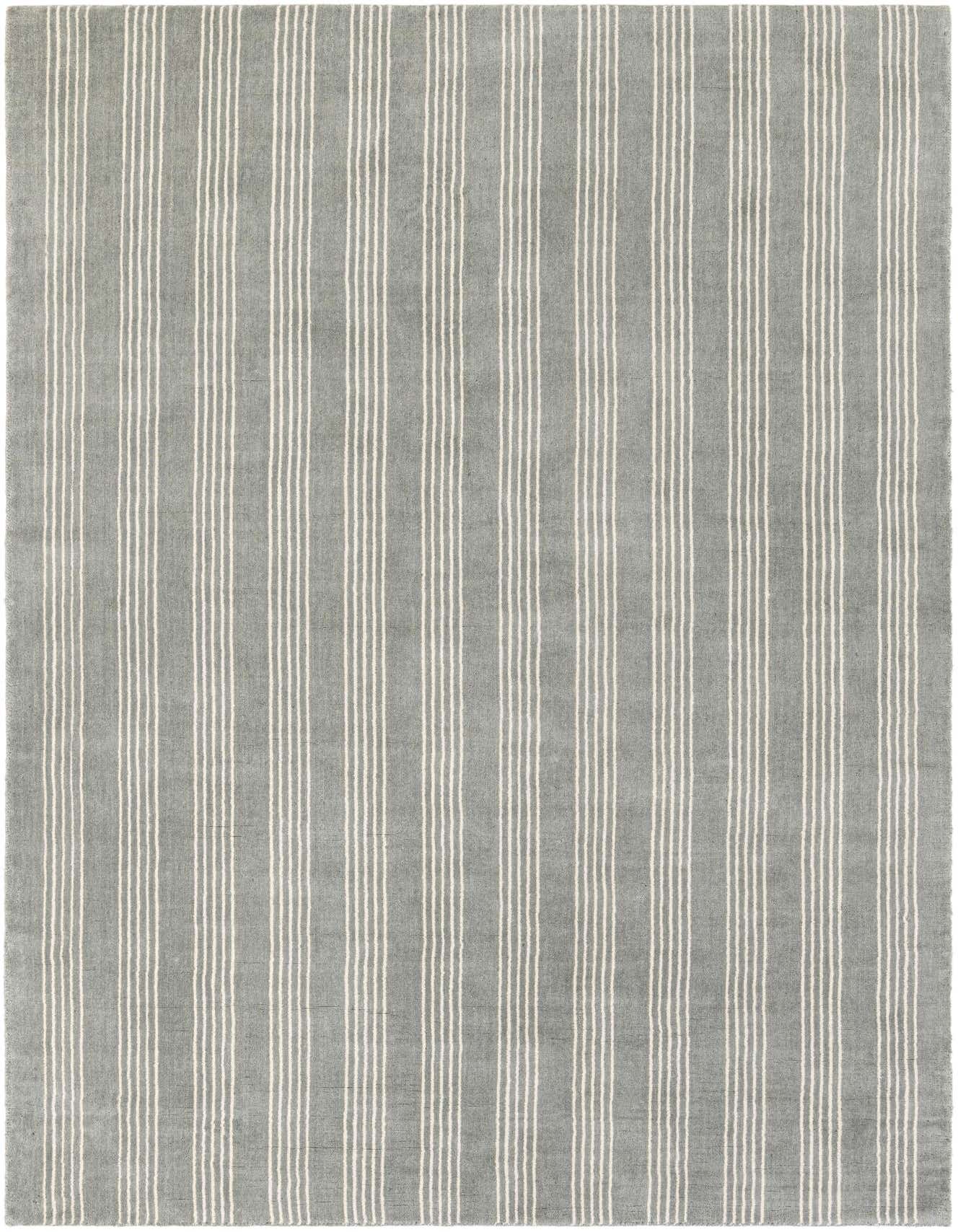 A 6x9 rectangular gray area rug with a modern vertical stripe pattern, made from wool and cotton.