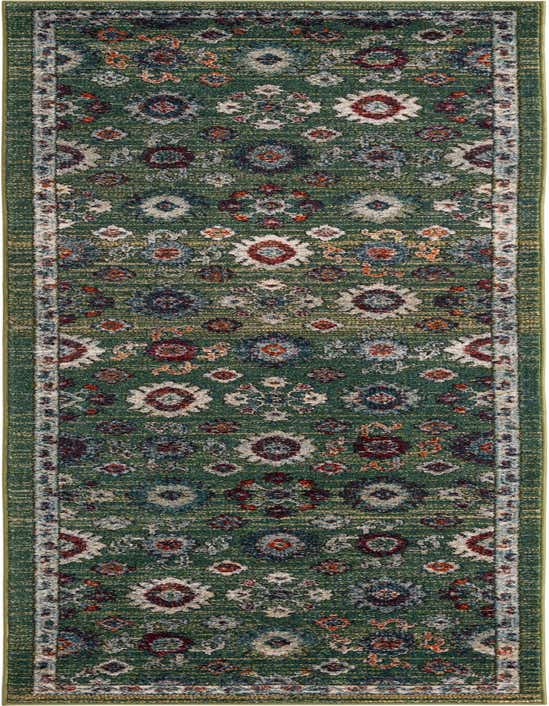 A 10 ft runner rug in shades of green with a distressed traditional pattern featuring red, blue, and cream floral motifs.