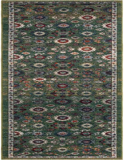 A long 13 ft runner rug in shades of green with an ornate, distressed traditional pattern featuring red, blue, and cream accents.