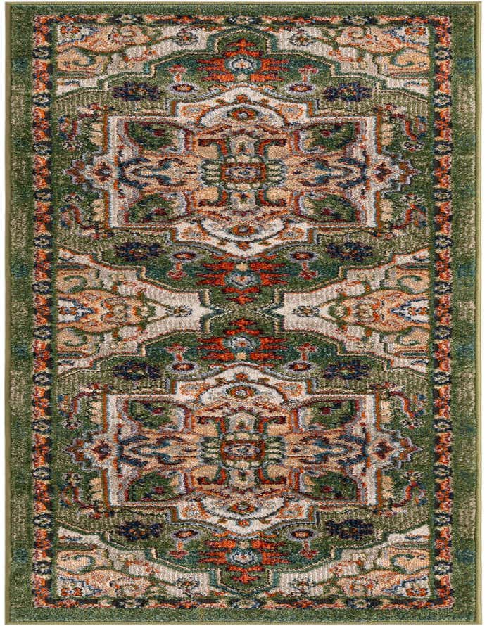 A 6 ft runner rug in shades of green with an intricate, distressed traditional pattern featuring orange, cream, and blue accents.