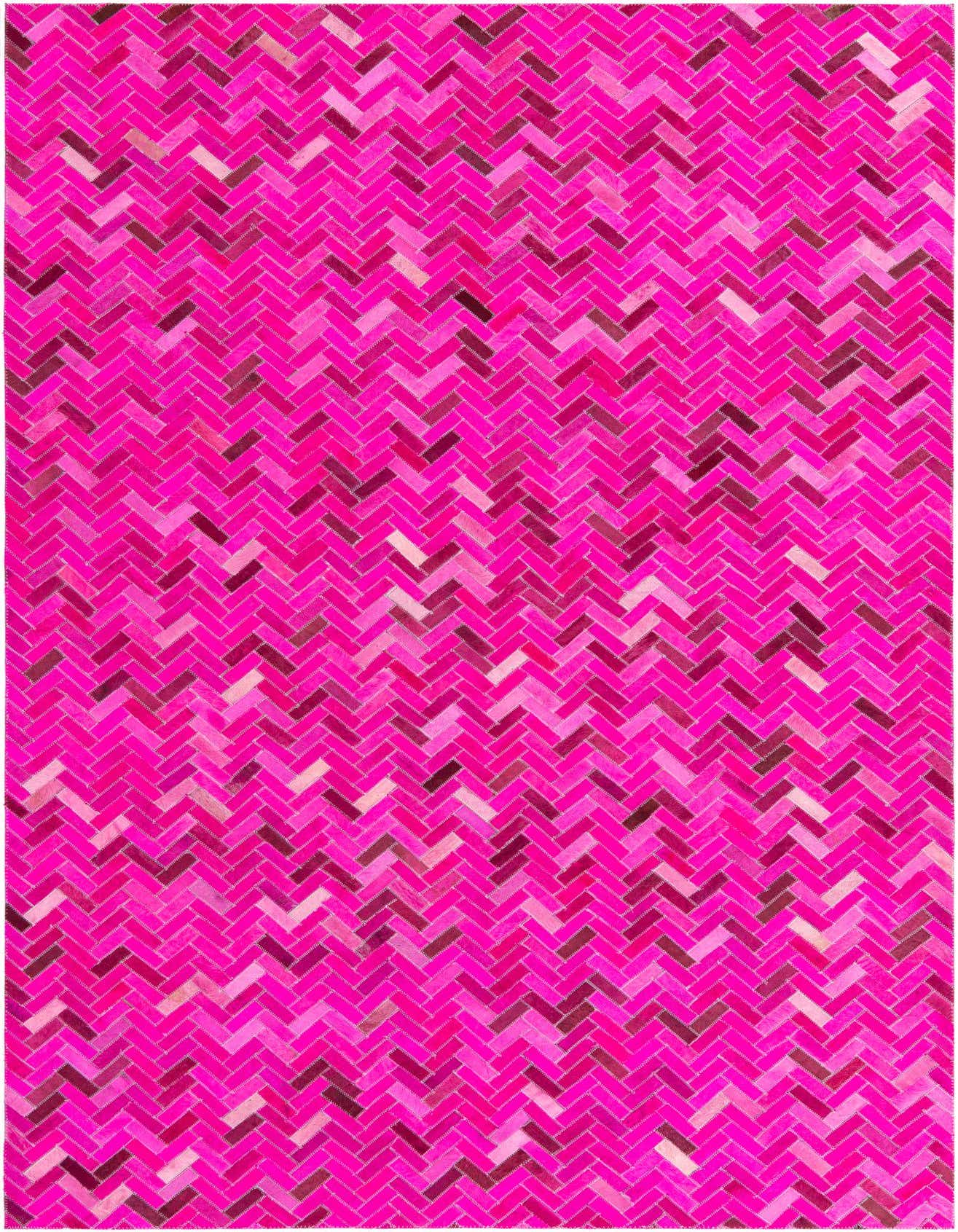 A 5x8 rectangular pink cowhide rug featuring a modern herringbone pattern, showcasing various shades of pink and magenta.