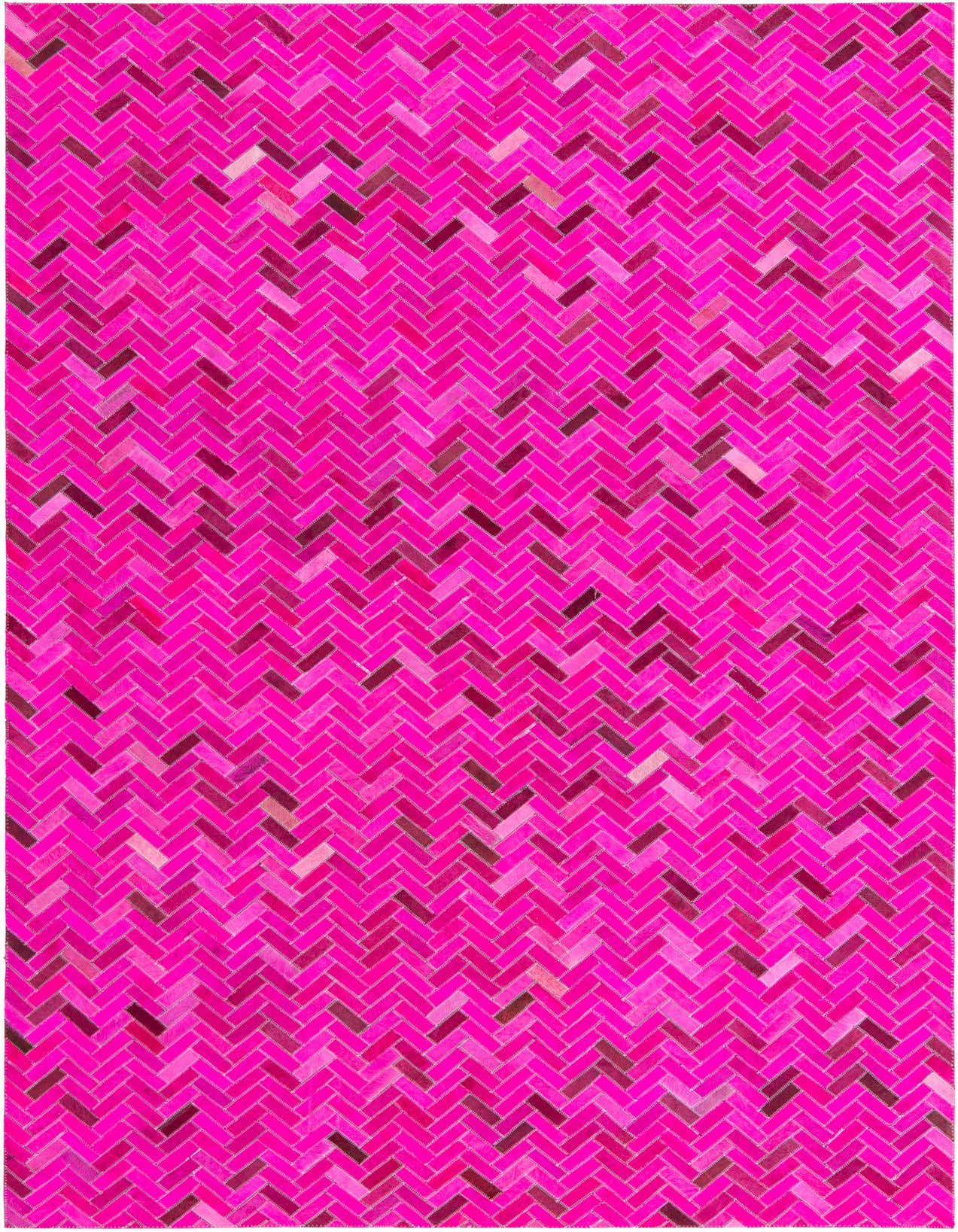 A vibrant 5x8 rectangular rug featuring a modern herringbone pattern in various shades of pink cowhide and leather.