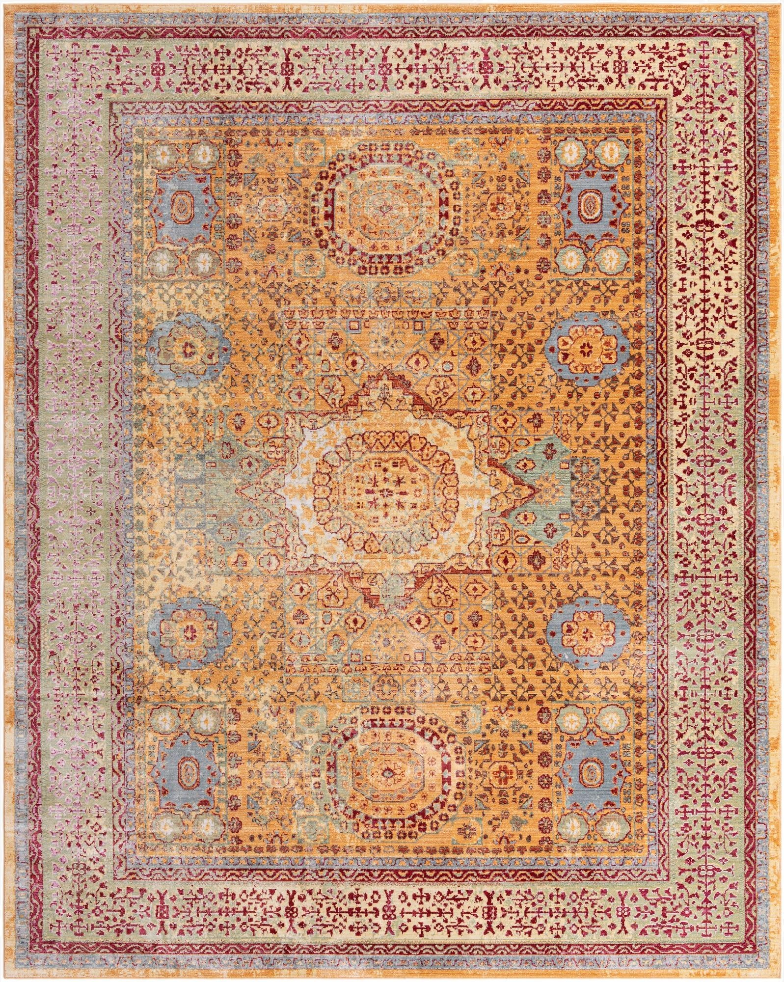 A 10x13 rectangular yellow and gold Bohemian rug with traditional medallion patterns and a faded, distressed look.