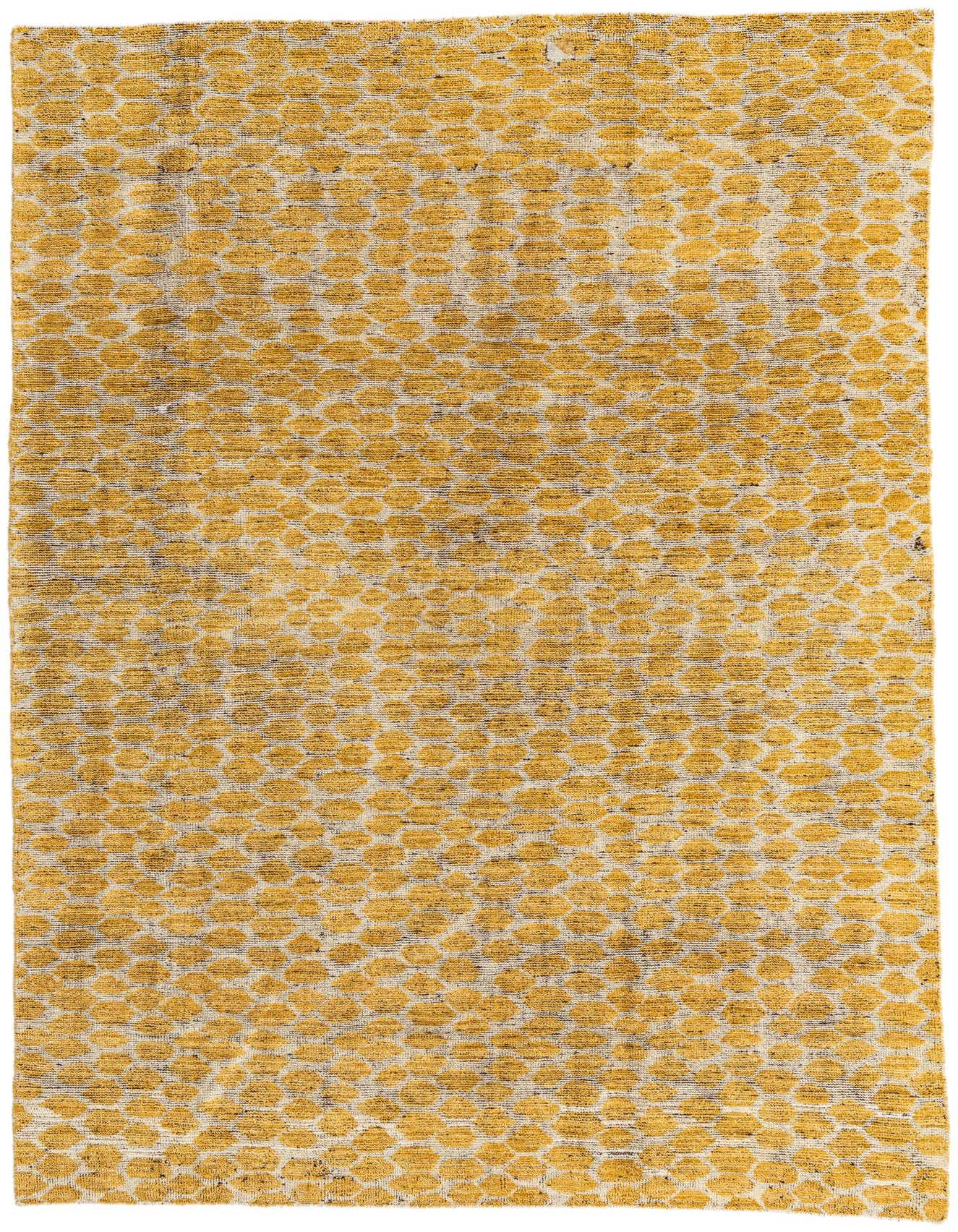 A 6x9 rectangular wool shag rug featuring a modern tribal pattern of yellow-gold ovals on a light background.