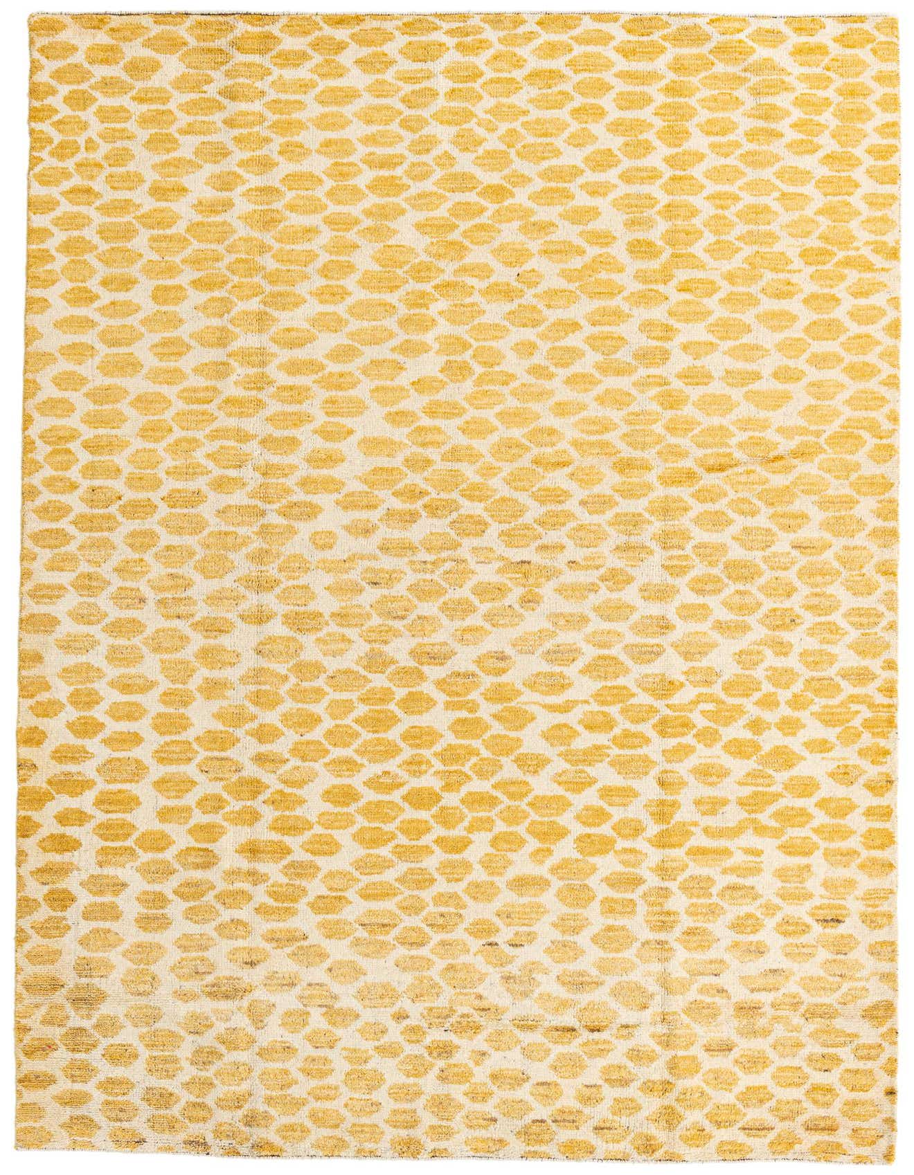 A 6x9 rectangular yellow and cream wool shag rug with an abstract tribal pattern, suitable for a living room or bedroom.