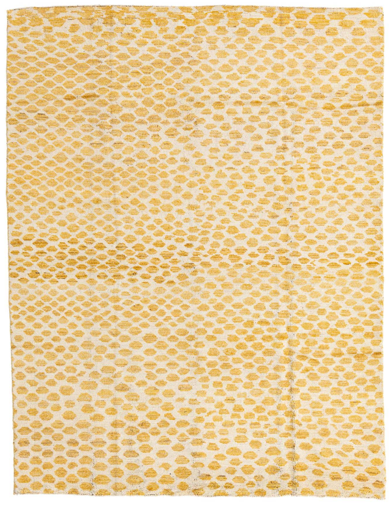 A 6x9 rectangular yellow and cream shag rug with an abstract tribal pattern, perfect for a living room.