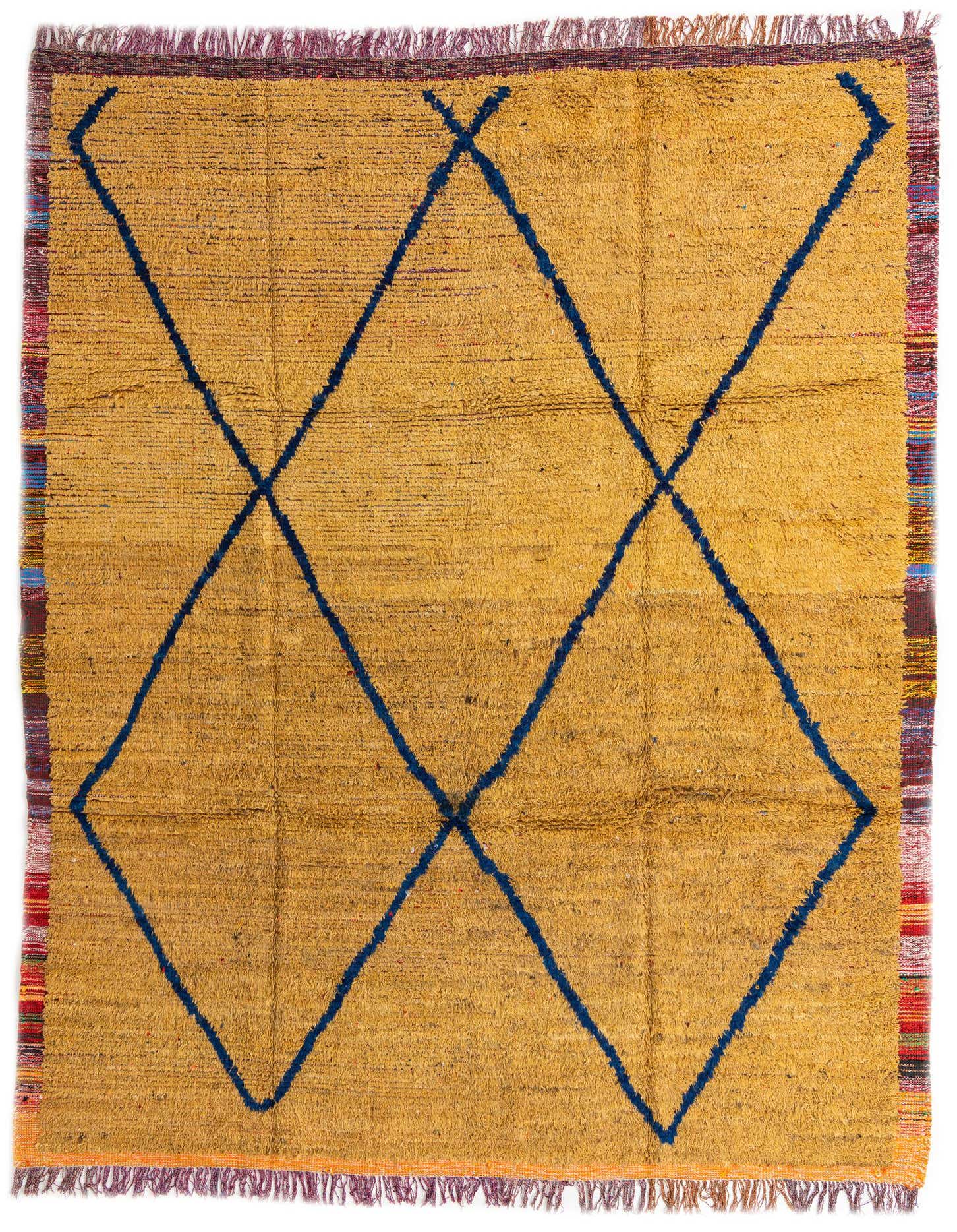 A 9x12 rectangular yellow shag rug with a bold blue tribal diamond pattern and fringed edges, suitable for a living room.