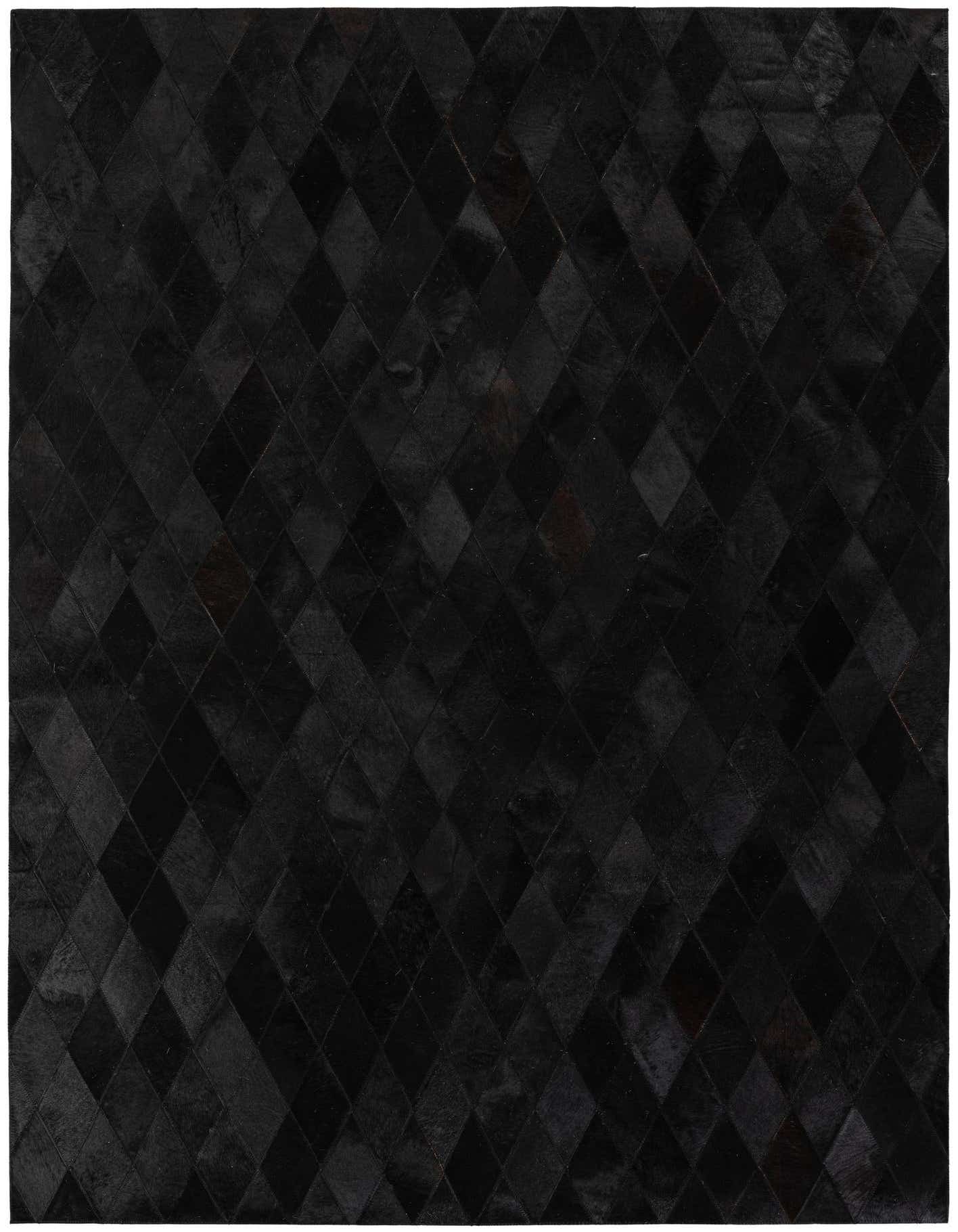 A 5x7 rectangular modern cowhide rug in varying shades of gray, featuring a diamond patchwork pattern.