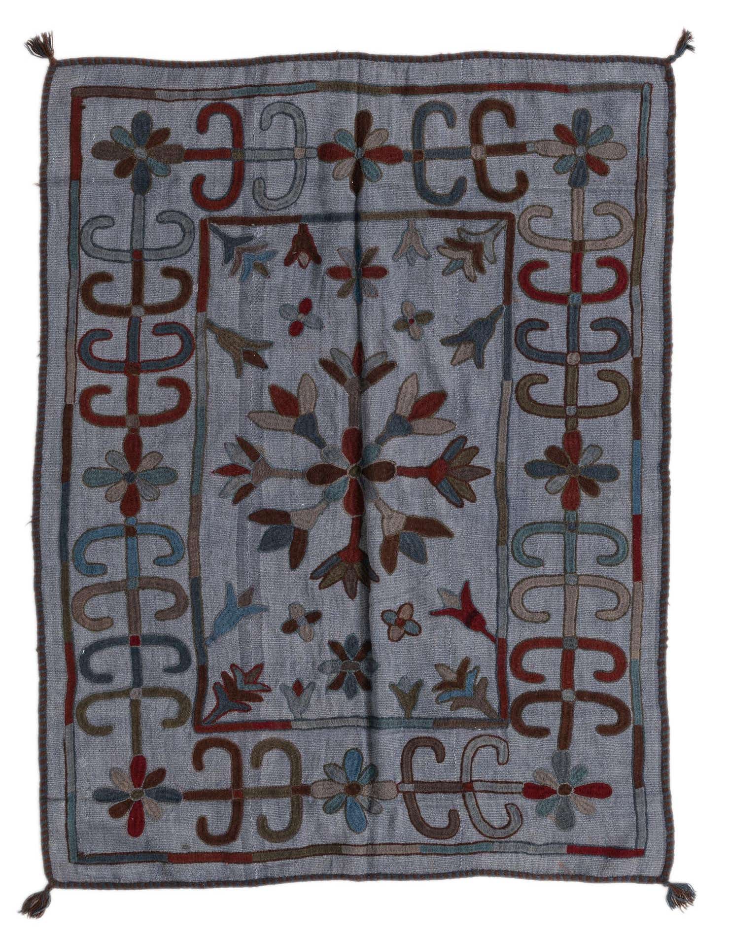 A 4x6 rectangular gray flatweave rug with a colorful tribal pattern featuring a central medallion and border.