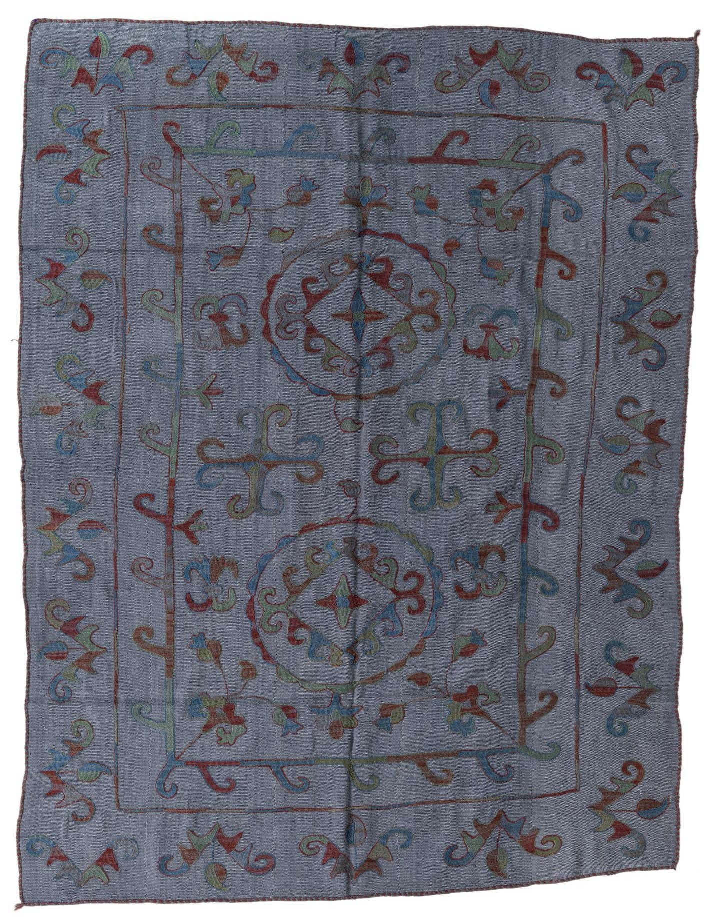 A 5x8 rectangular gray Kilim Suzani wool rug with colorful tribal and oriental patterns in red, blue, and green.