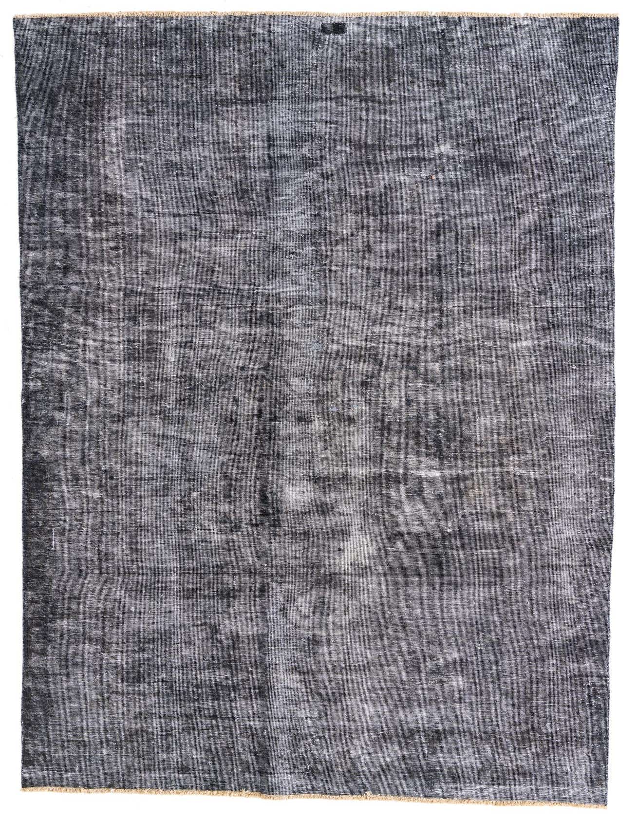 A 7x10 rectangular gray wool rug with a distressed Persian-inspired pattern, ideal for a living room.