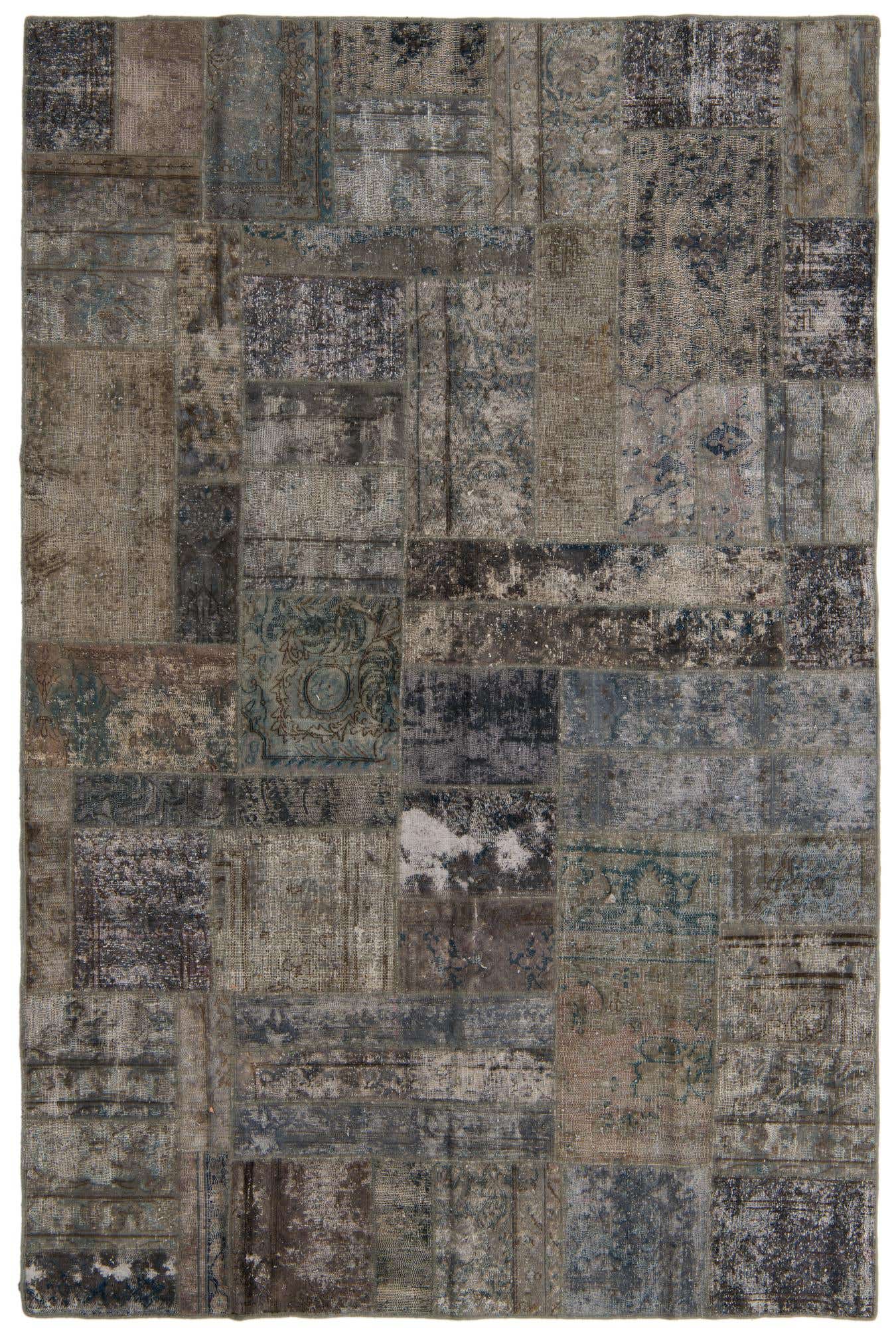 A 6x9 rectangular Ultra Vintage rug featuring a distressed patchwork design in shades of gray and silver.