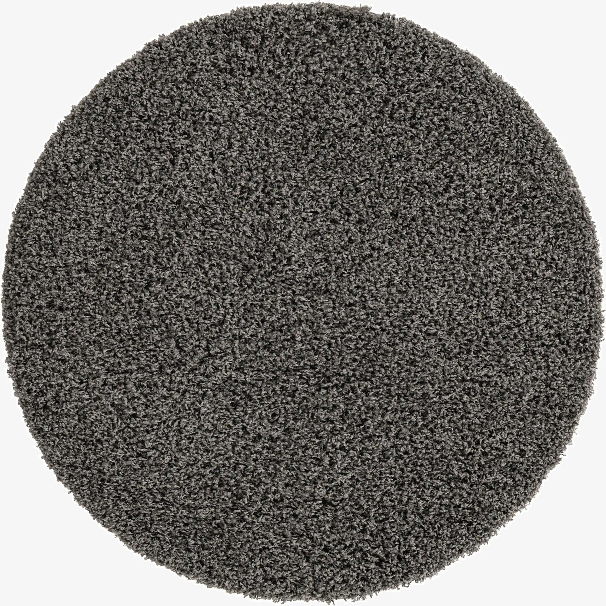 A 4' round gray shag rug with a soft, textured pile, perfect for adding comfort to any indoor space.