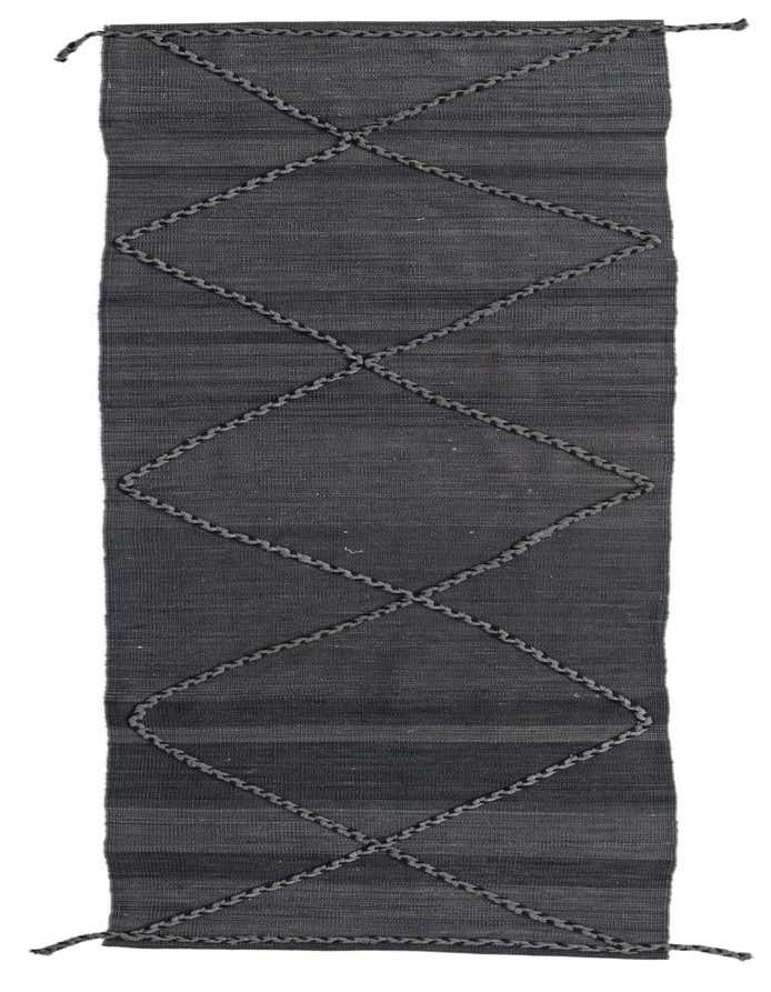 A 10 ft runner rug from the Kilim Modern collection, featuring a dark gray flatweave with a textured tribal diamond pattern.