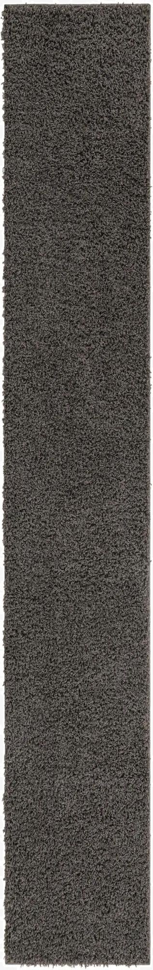 A long, rectangular 16 Ft runner rug in a solid dark gray shag texture, ideal for a hallway.