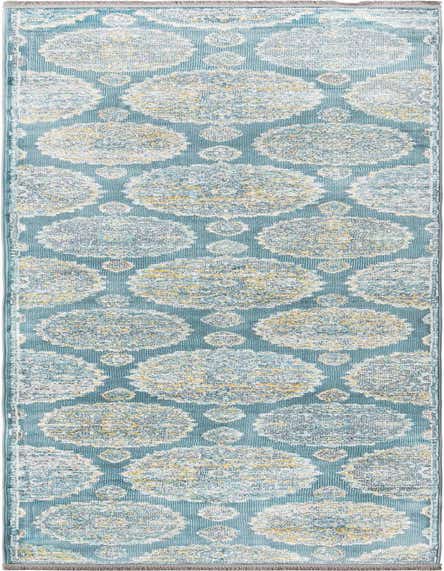 A 12 ft blue runner rug with a distressed bohemian floral pattern in shades of white, yellow, and light blue, perfect for a hallway.