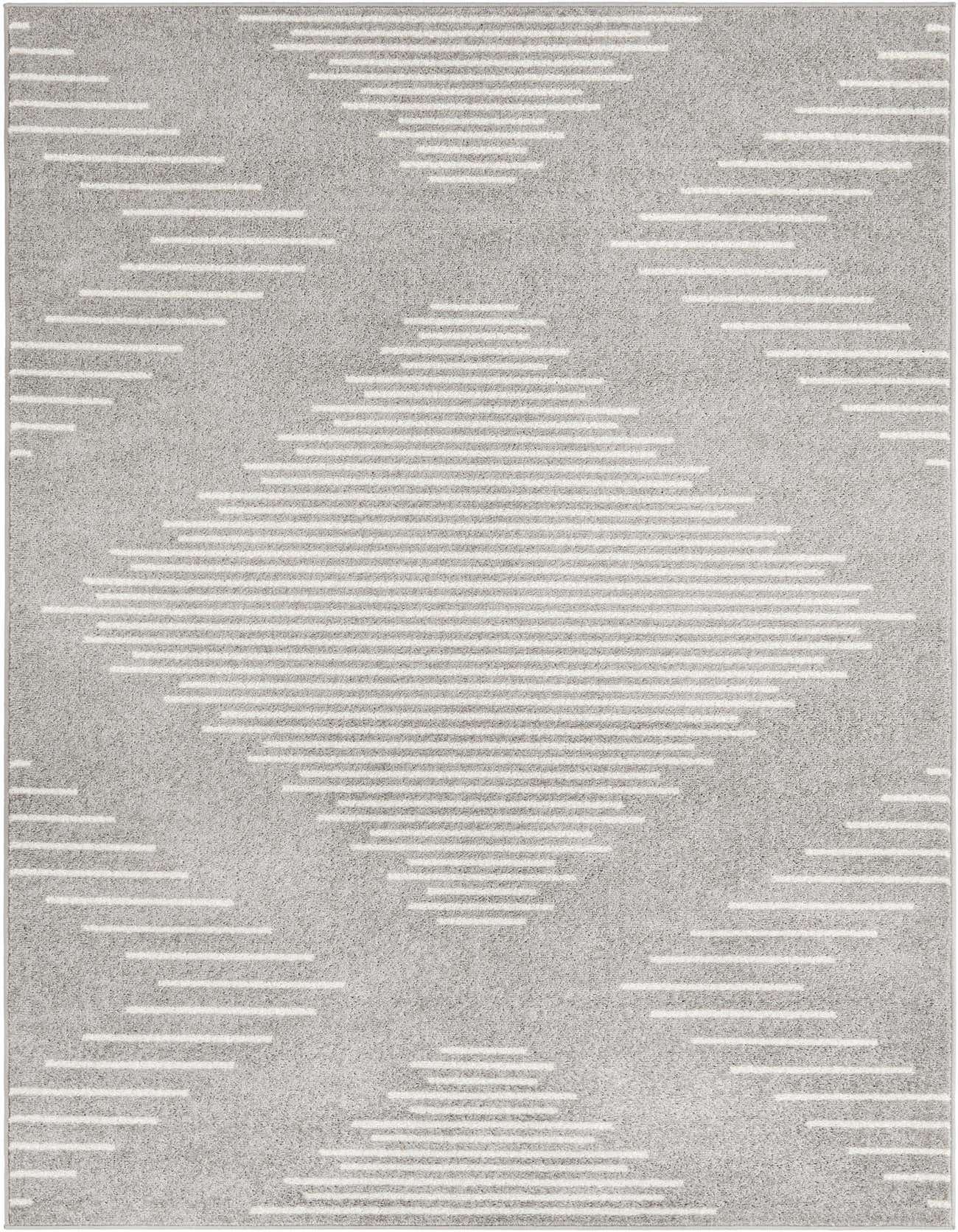 A 5x8 rectangular Kai rug from Rugs.com with a modern striped pattern in shades of ivory and gray, featuring a large central diamond.