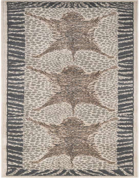 A 10 ft runner rug featuring a modern animal print design in ivories, creams, and grays, ideal for a hallway.