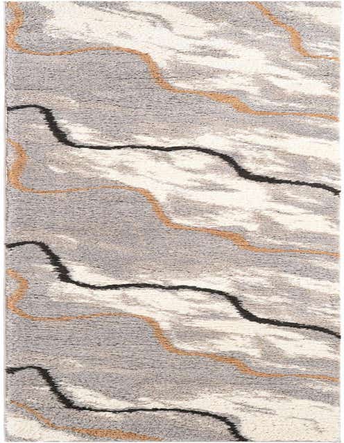 A textured 8 ft runner rug featuring abstract wavy lines in ivory, cream, gray, and black, with accents of brown.