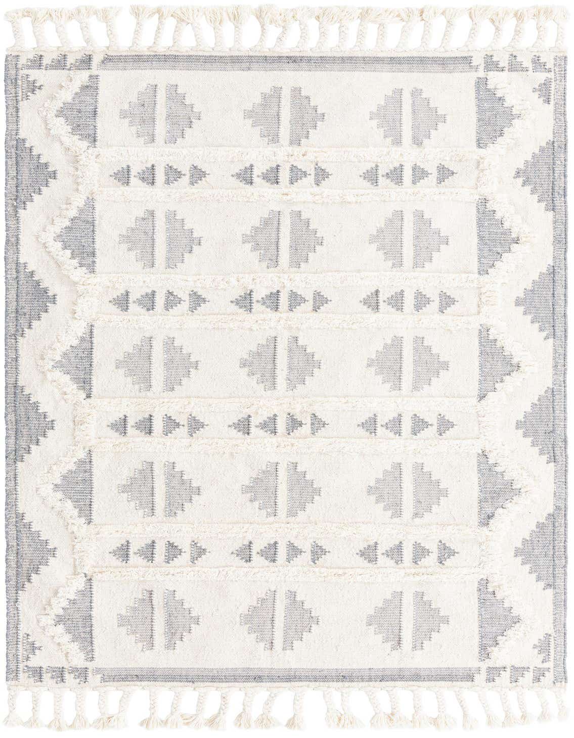 A 5x8 rectangular Arizona Collection rug by Rugs.com, featuring a tribal geometric pattern in gray and white with shag texture and tassels.