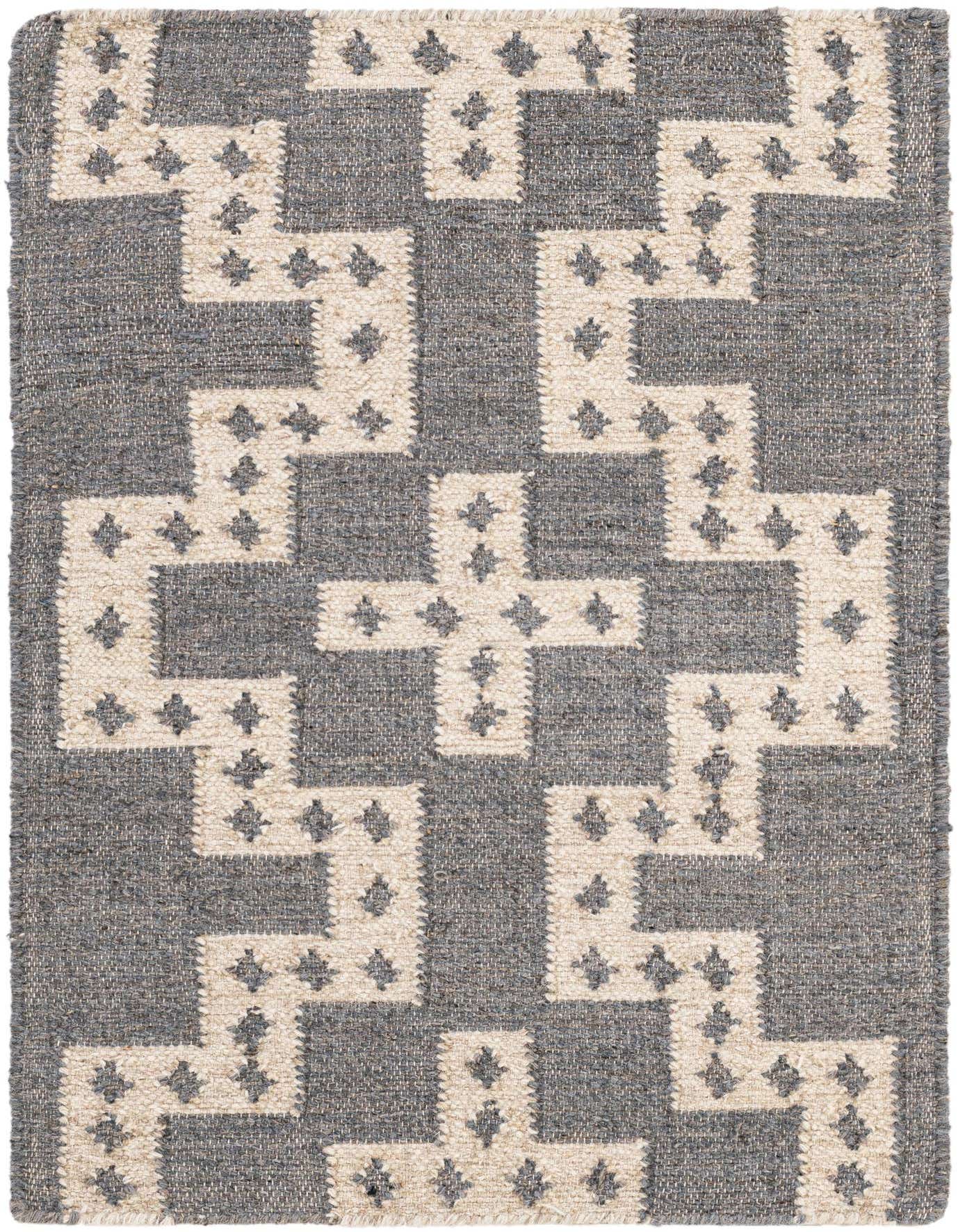 A 2x3 rectangular gray and white tribal wool rug with a repeating geometric pattern, suitable for an entryway.