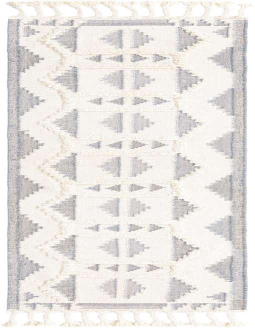 A 10 ft runner rug from the Arizona collection, featuring a tribal pattern in gray and white shag wool with tassels.