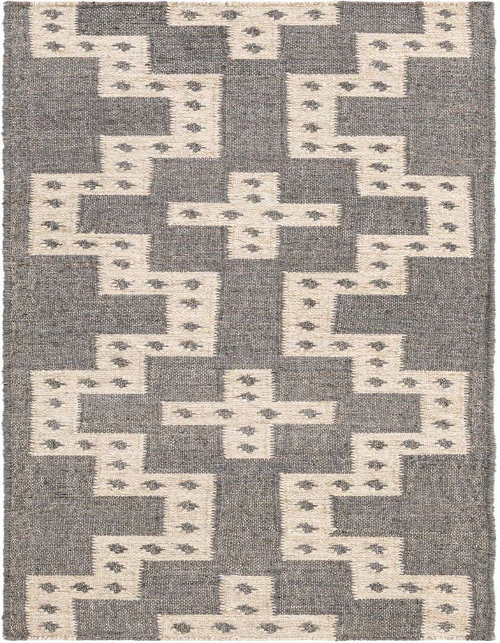 A 6 ft runner rug with a gray background and an interlocking white tribal geometric pattern, featuring small gray accents within the white shapes.