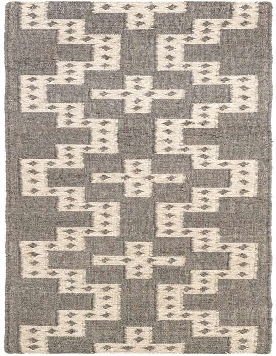 A gray 8 ft runner rug with a repeating white tribal geometric pattern, suitable for a hallway or kitchen.