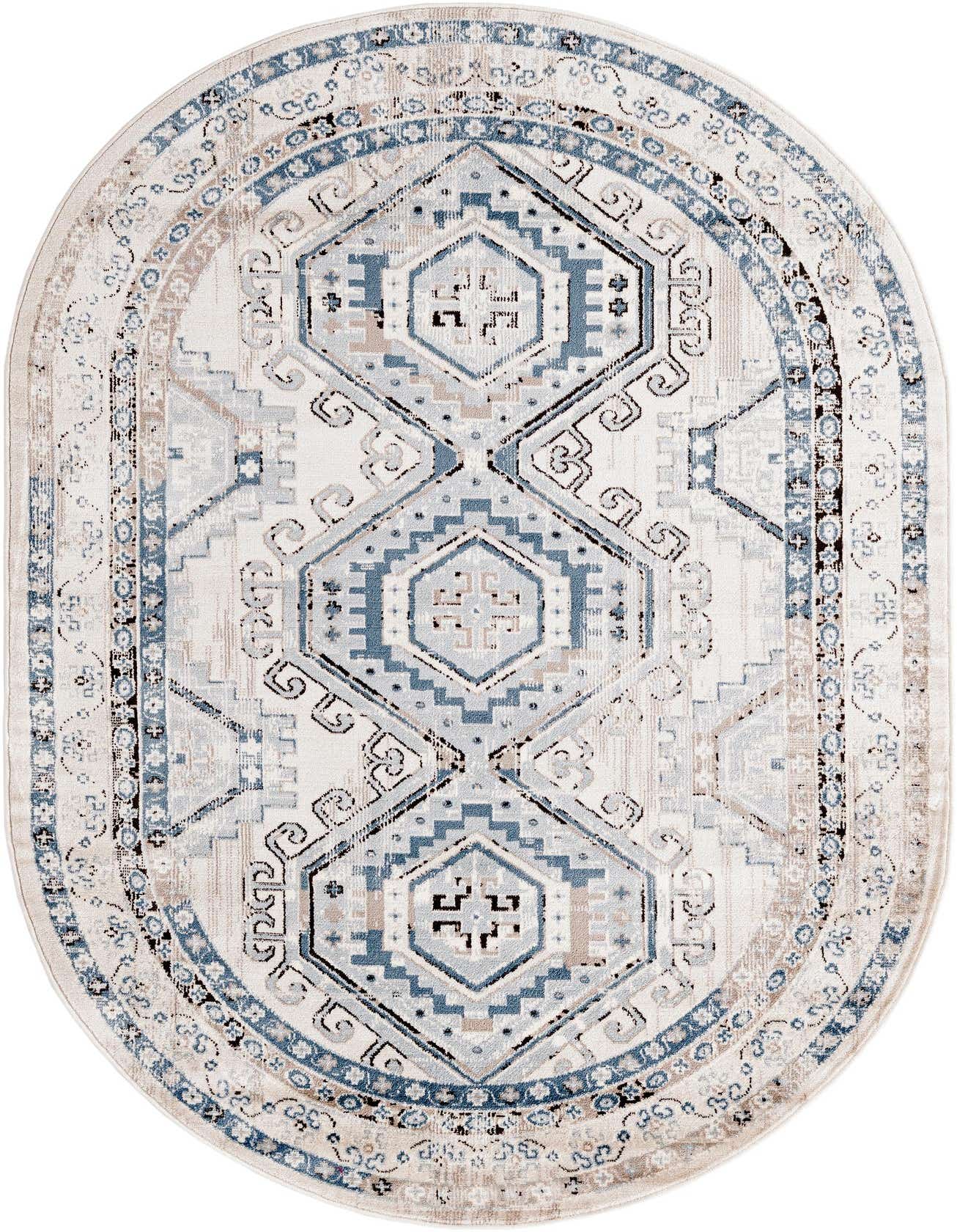 An oval 5' 3 x 8' 0 Charlotte rug featuring a traditional tribal pattern in blues, grays, and silvers on a light background.