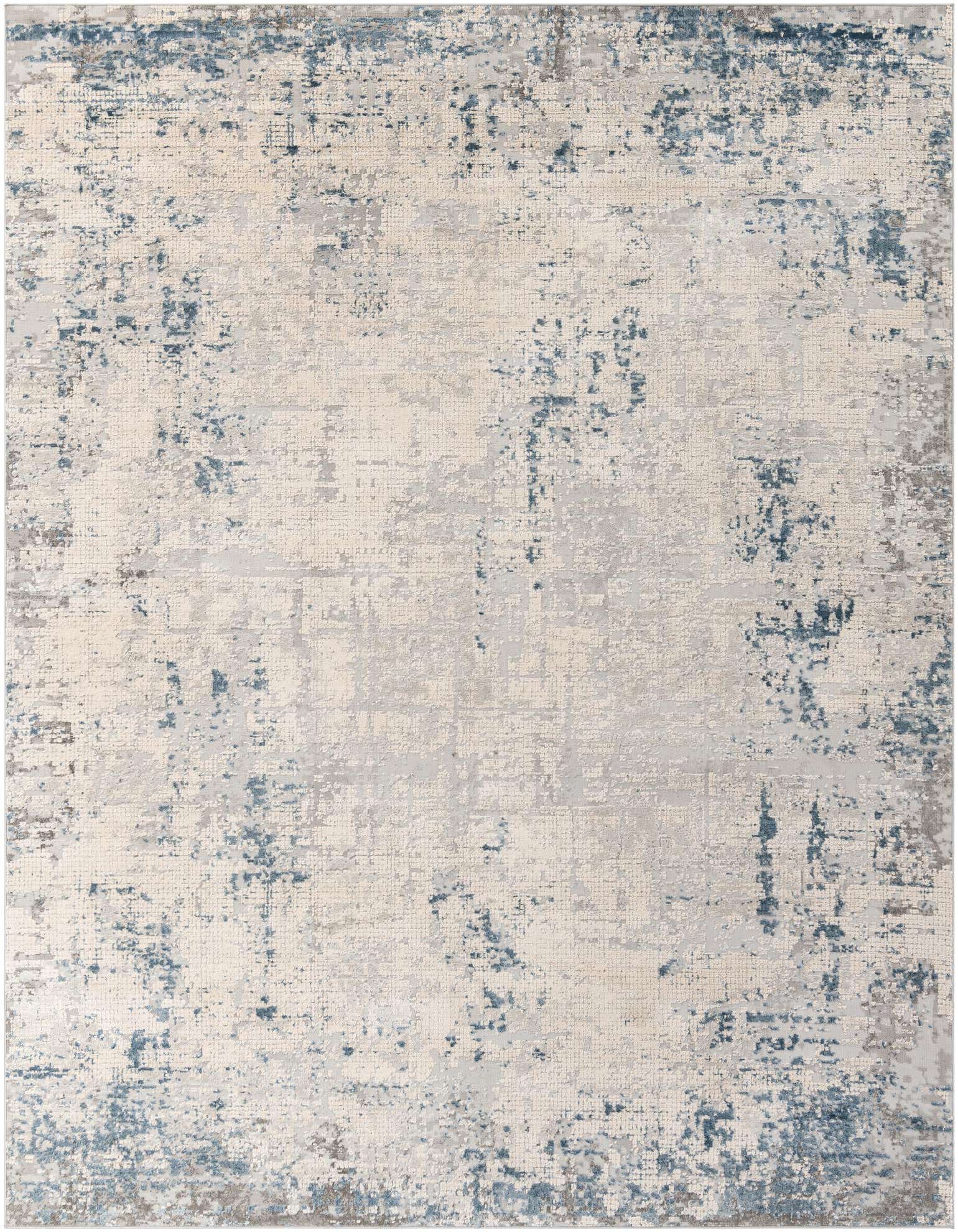 A 9x12 rectangular indoor rug with an abstract urban pattern in varying shades of blue, gray, and silver.