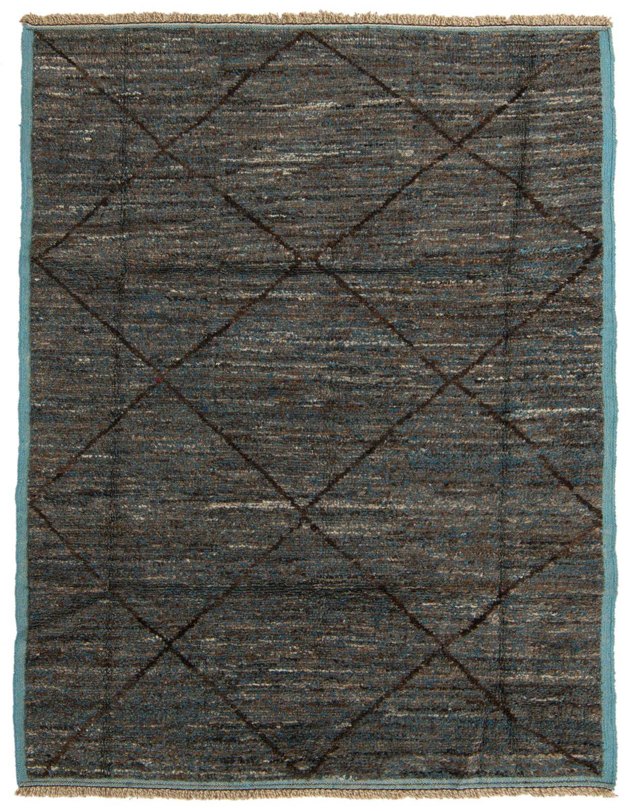 A 6x9 rectangular Moroccan shag rug in blues and grays, featuring a tribal diamond pattern.