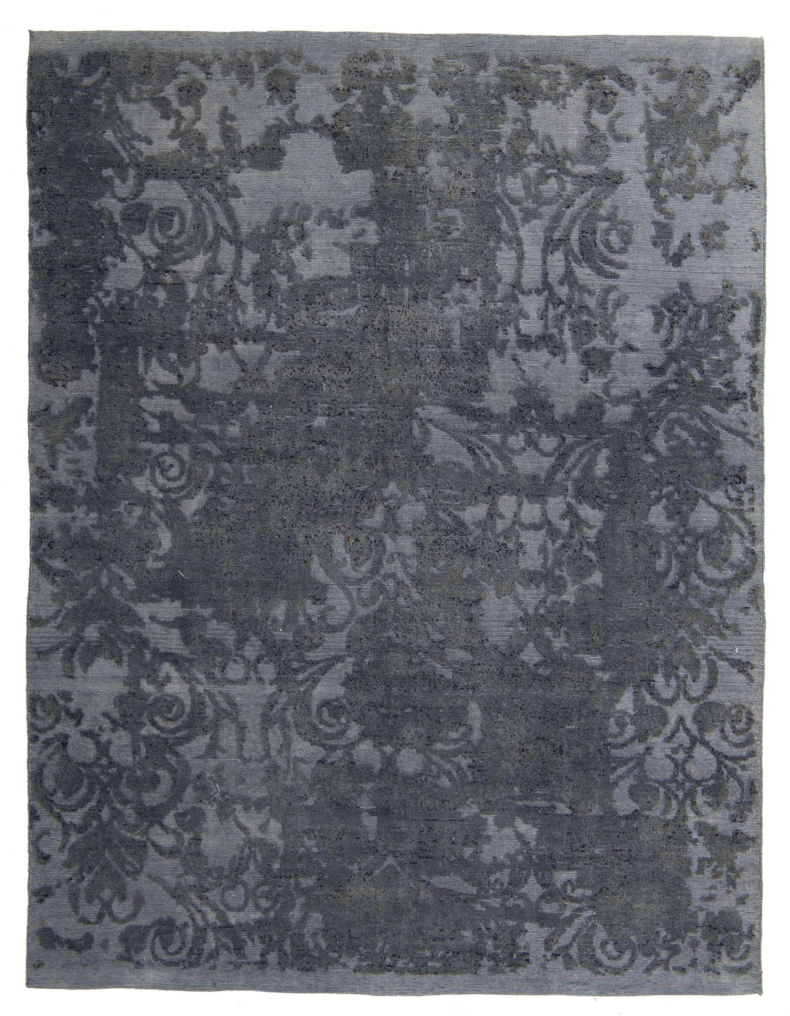 An 8x10 rectangular blue and gray wool rug with a distressed Persian floral pattern, ideal for a living room.