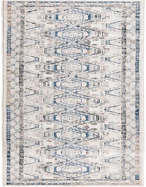 A 13 ft runner rug with a distressed traditional tribal pattern in shades of blue, gray, and cream, ideal for a hallway.