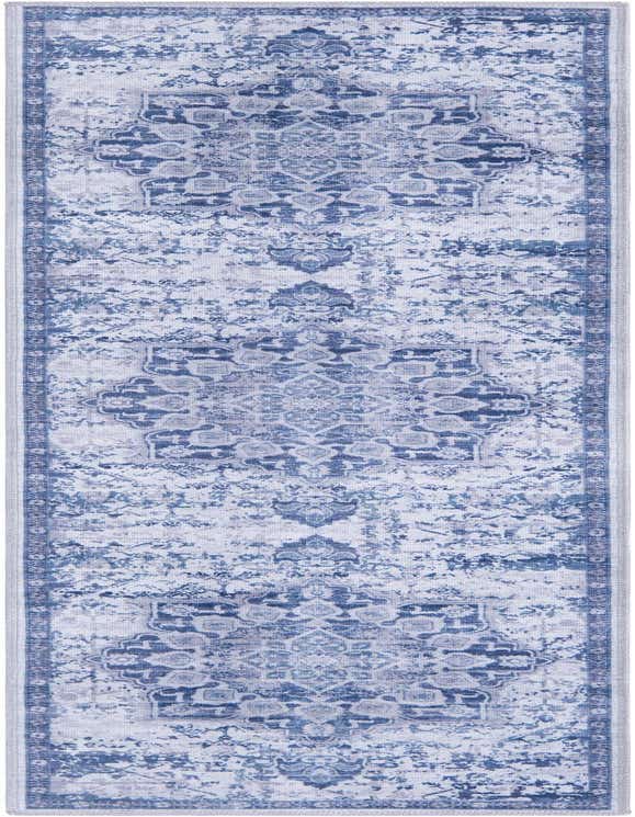 A 7 ft runner rug in blues and grays featuring a distressed traditional medallion pattern, ideal for a hallway.