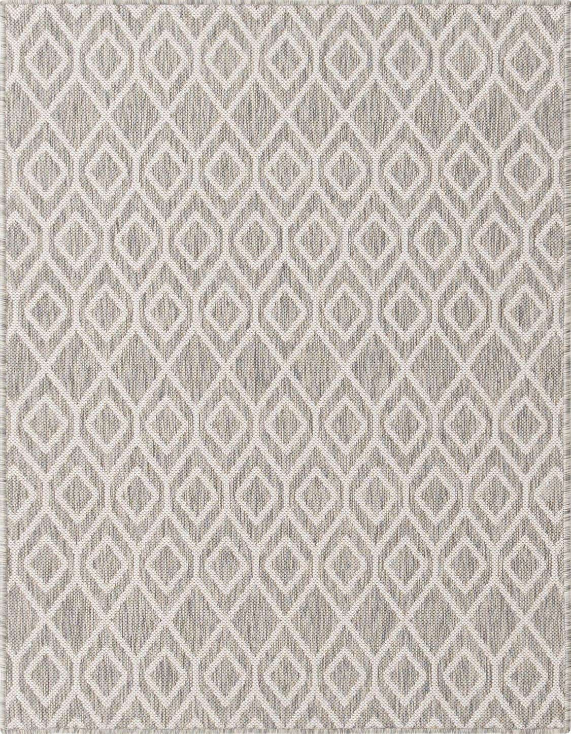 A 3x5 rectangular Jill Zarin Outdoor rug featuring a modern ivory and gray tribal trellis pattern on a textured flatweave.