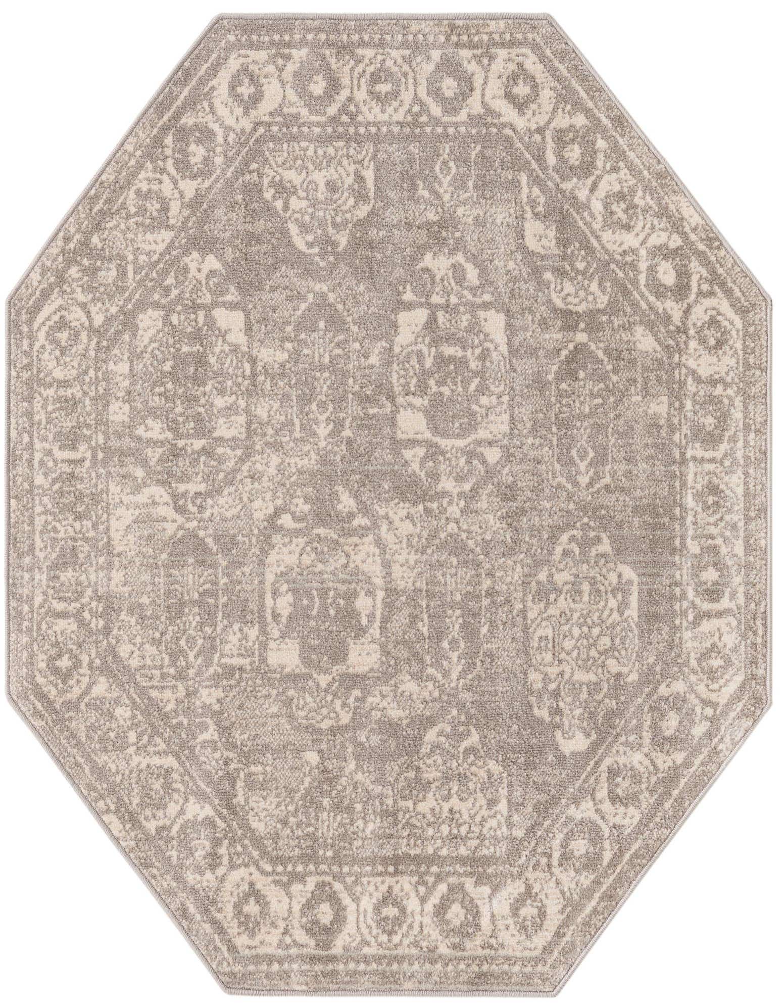 Octagon-shaped gray and cream bohemian rug with a distressed traditional medallion and border pattern.