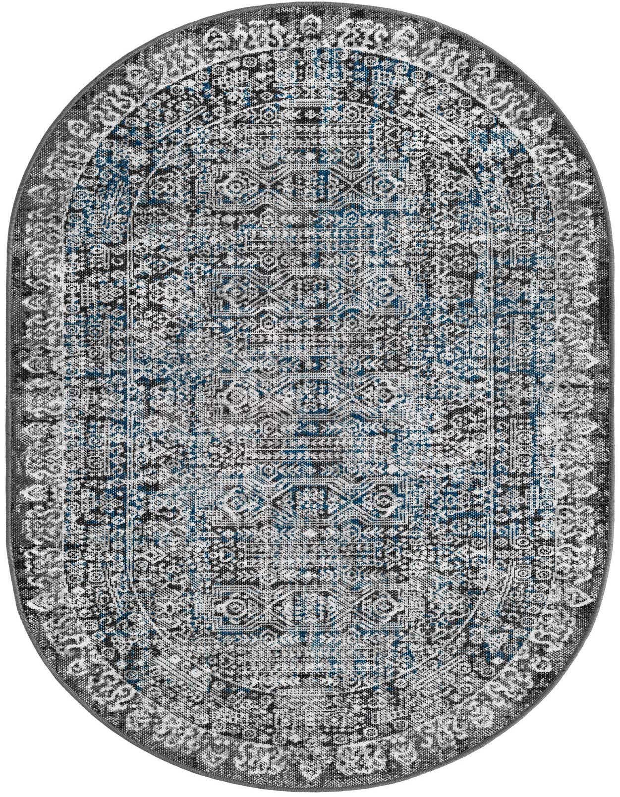 A 3' 3 x 5' 3 oval gray and blue polypropylene rug with a distressed traditional pattern.