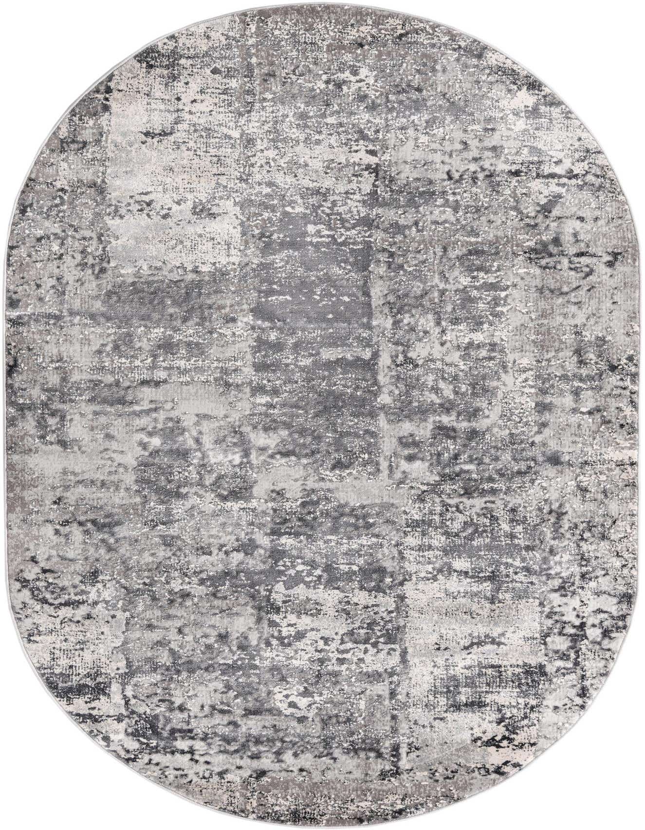 An oval 5'3" x 8'0" gray and silver modern abstract rug with a distressed, high-low textured pile.