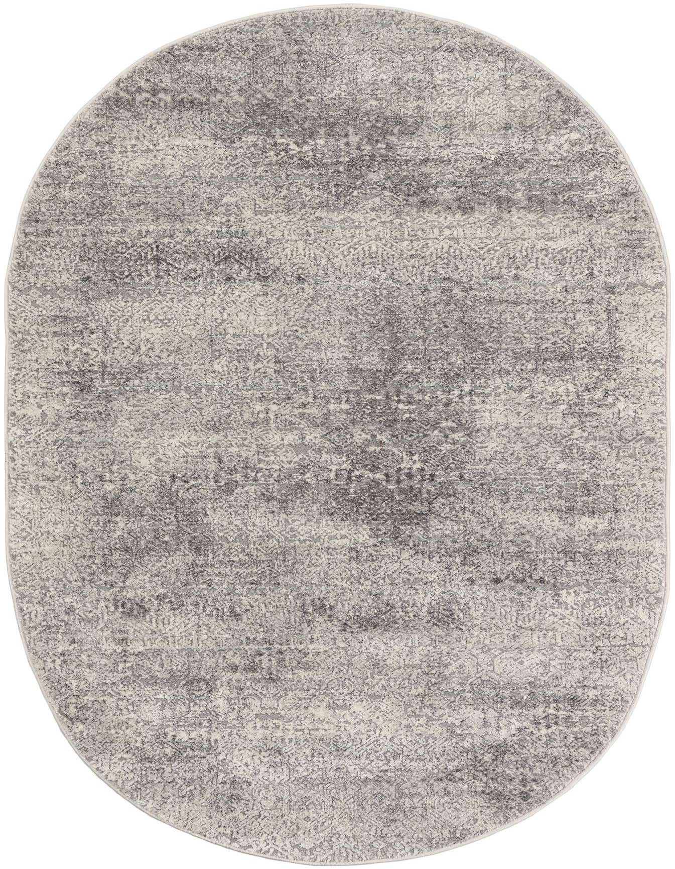 A 4' 1 x 6' 1 oval Finsbury rug from Rugs.com, featuring a modern, distressed gray and silver pattern with a medium pile.
