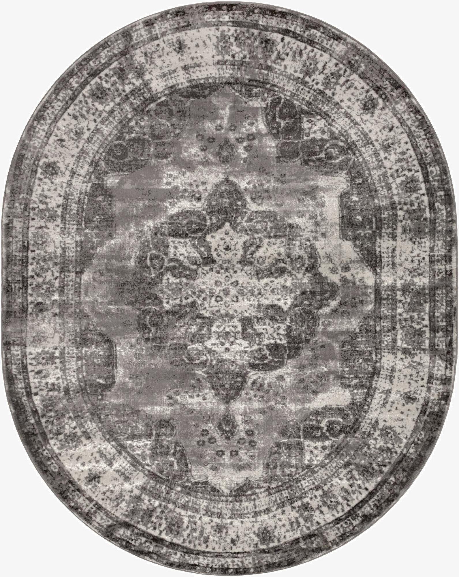 An oval 7' 10 x 10' 0 gray bohemian rug from the Monte Carlo collection, featuring a distressed medallion pattern.